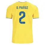 Yellow soccer jersey with D. Muñoz and number 2.
