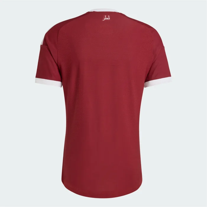 Back of maroon Adidas jersey with white trim and قطر text.