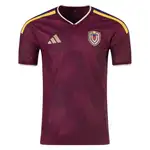 Adidas burgundy soccer jersey with gold logo and team badge.