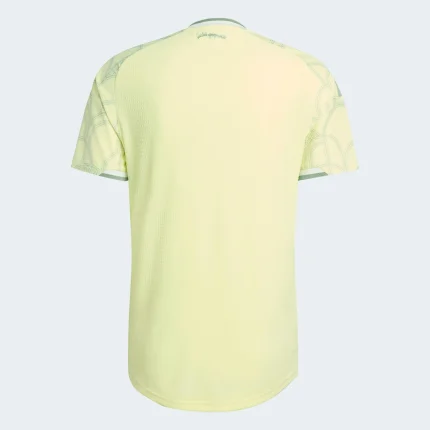 Back of yellow t-shirt with patterned sleeves.